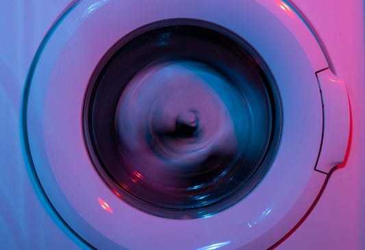 Close-up of wwashing machine in neon light