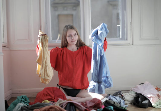 Young woman investigating her laundry