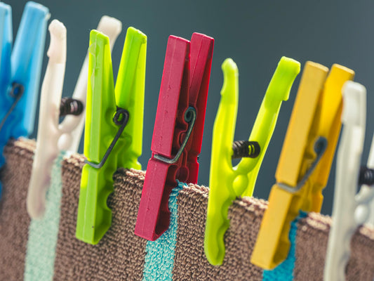 Colourful laundry pins on a washing line